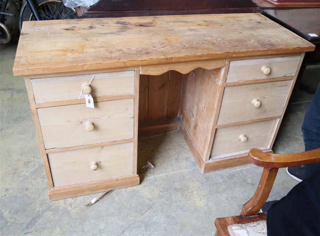 A pine kneehole dressing table, width 129cm, depth 49cm, height 74cm